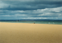 Mentone Beach , Melbourne, with Mordialloc Pier in the middle distance in front of the Frankston seen in the distance.